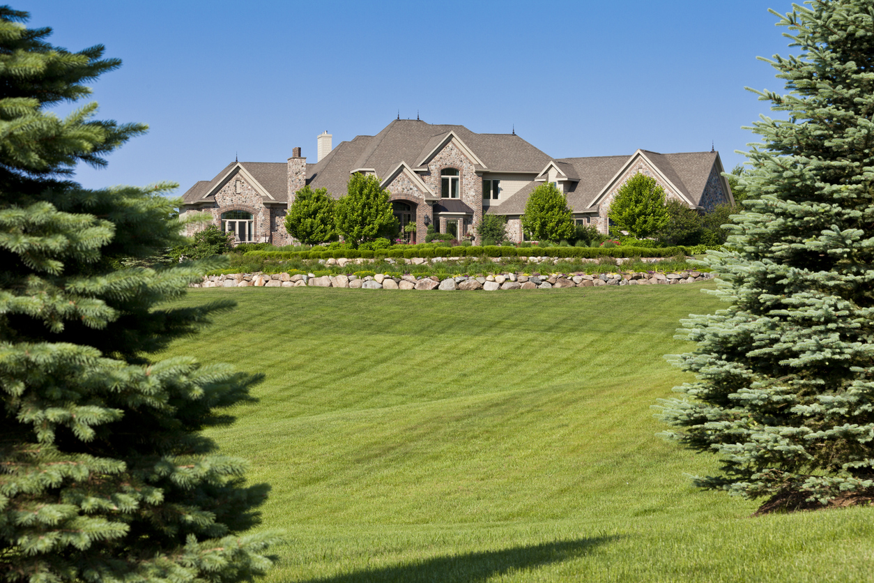 mansion with huge green lawn