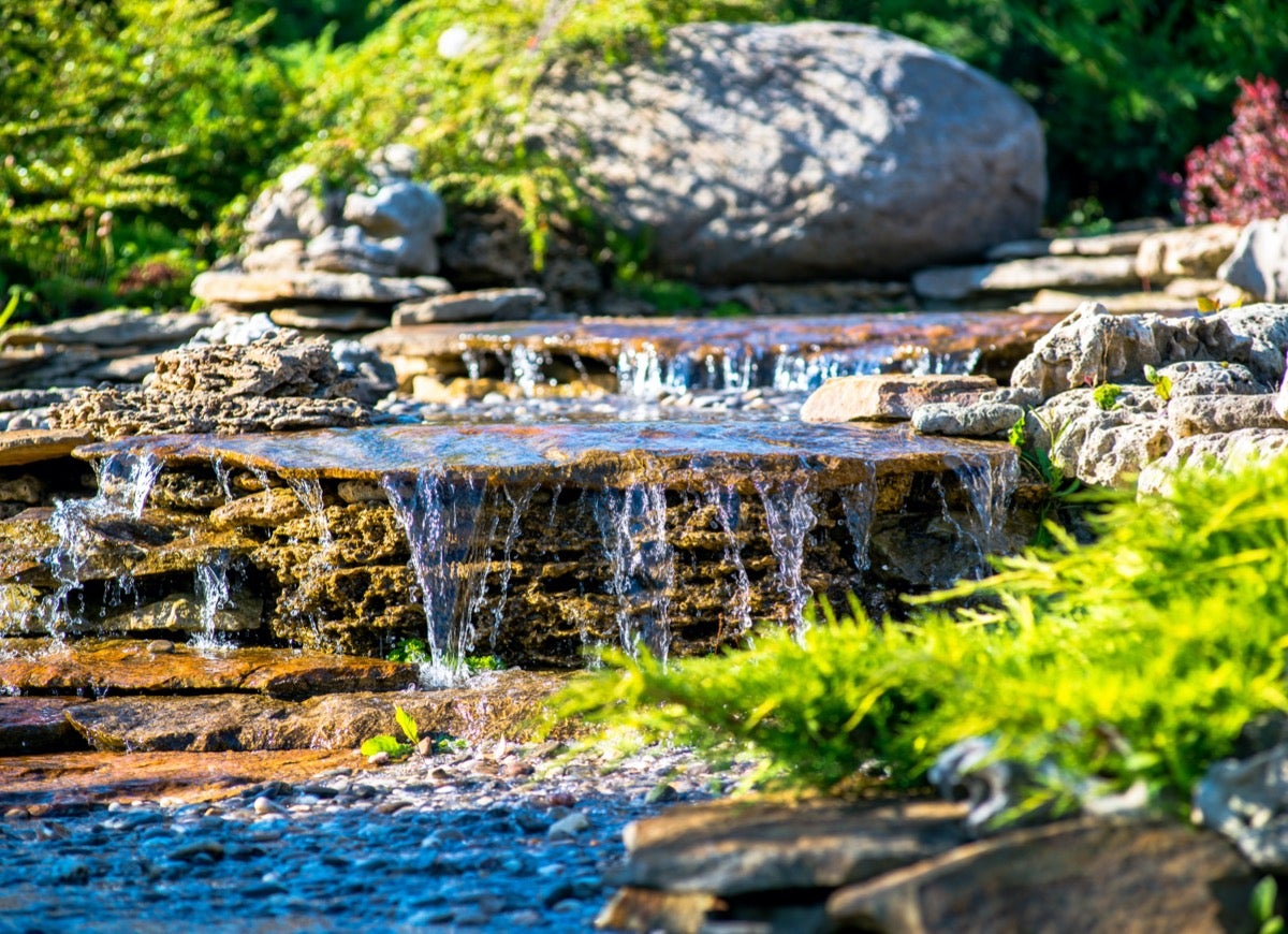 9 Relaxing Pond Waterfall Ideas for Your Backyard