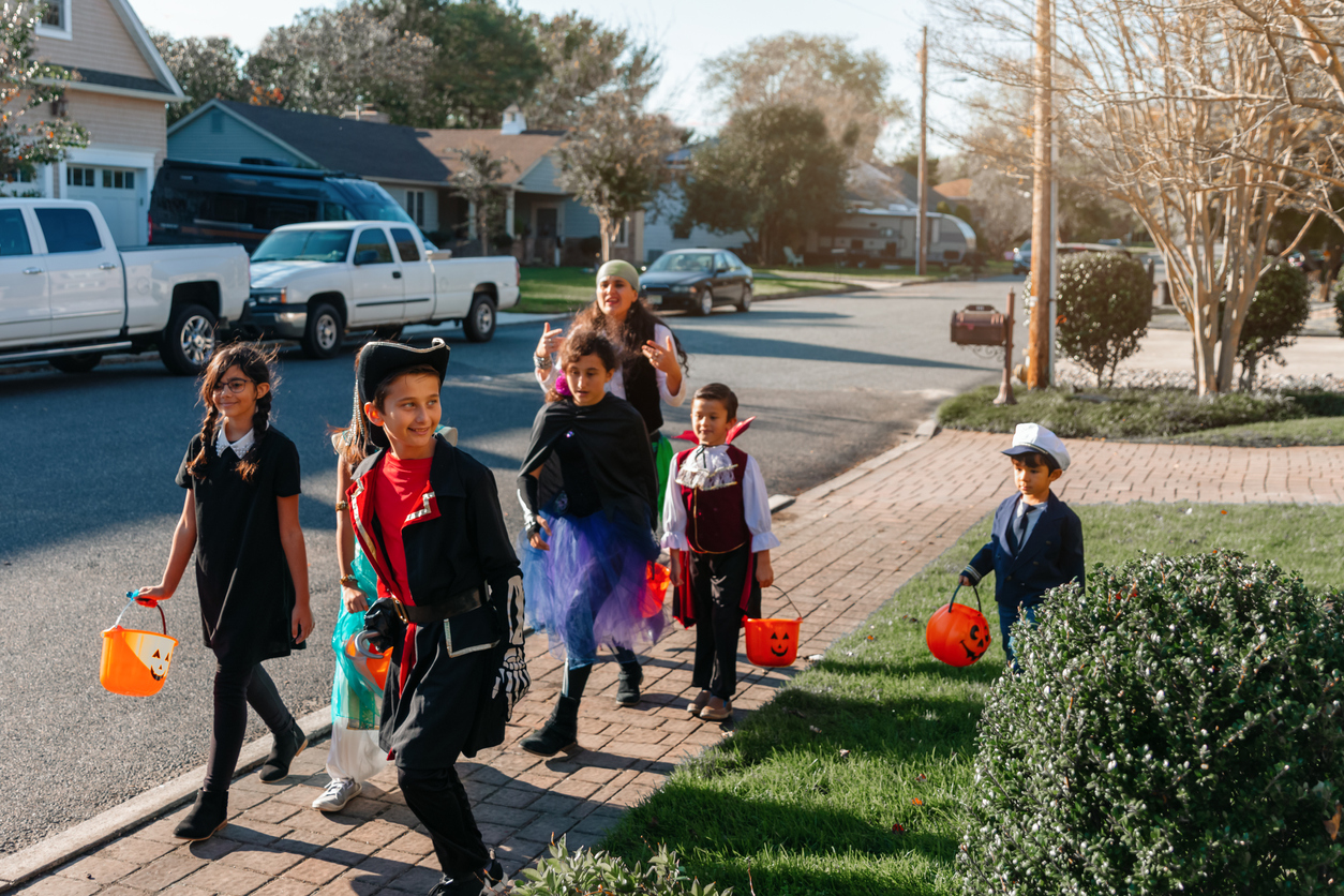 Boys and girls trick or treating on Halloween