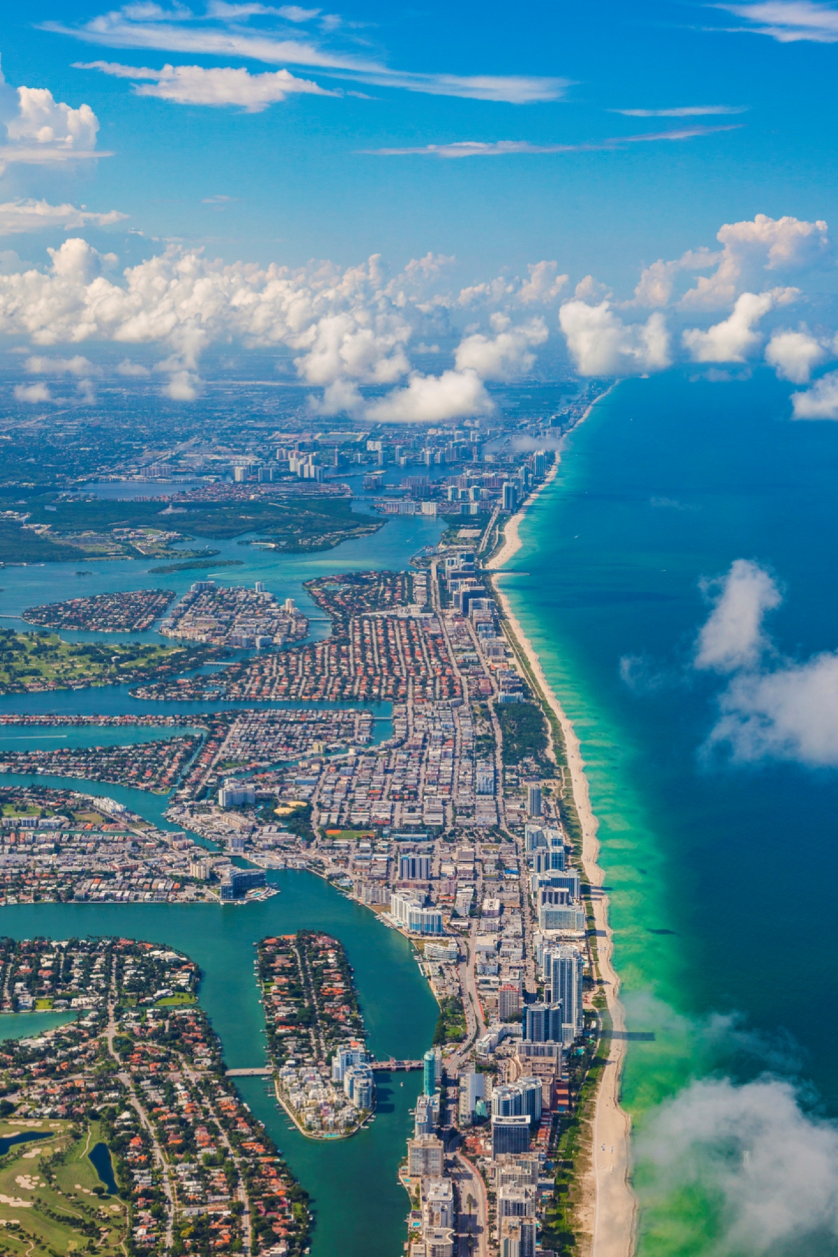 Aerial view of cityscape near ocean