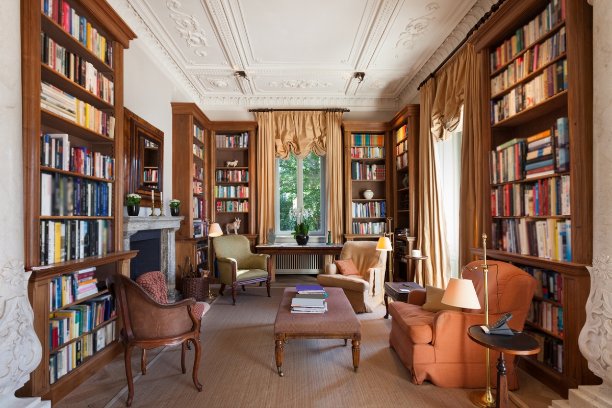 Interior of classical library with valance draped curtains