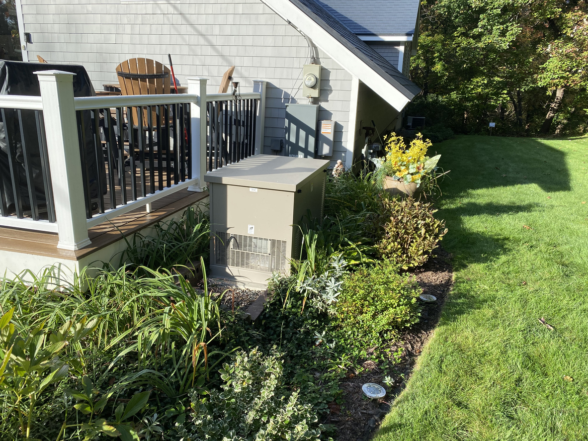 patio with a residential generator next to it