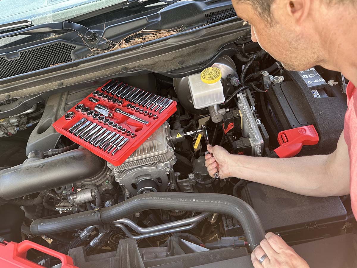 Man using Milwaukee Socket Set on car engine