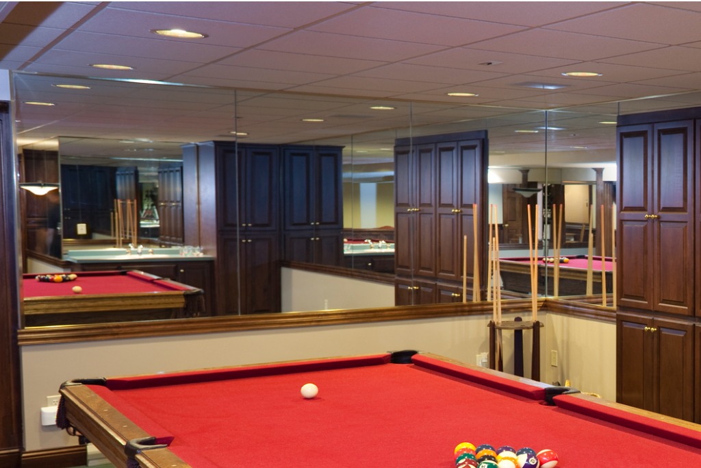 istock 183288066 real estate agents dont want basement game room with pool table and ceiling tiles drop ceiling