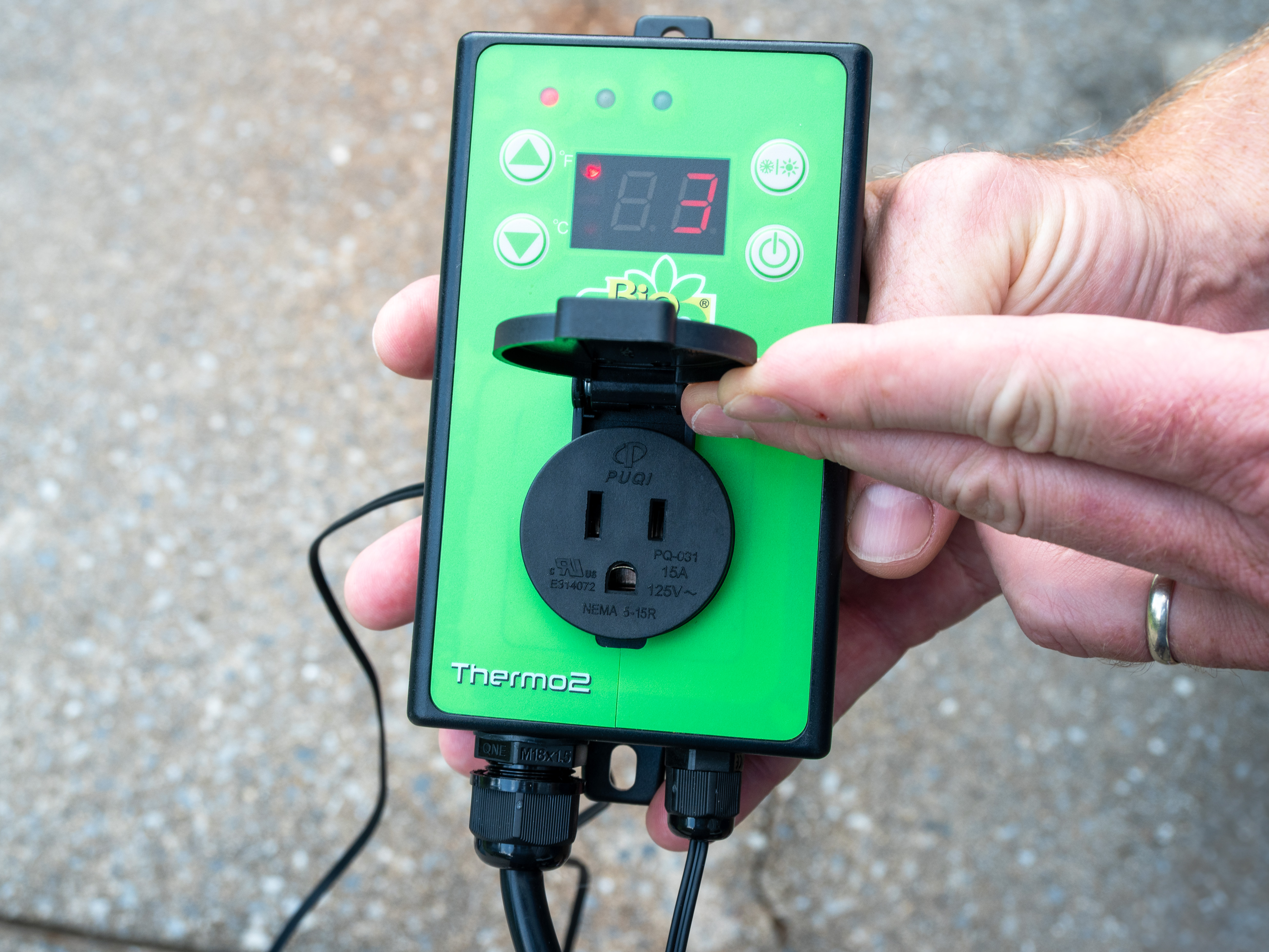 Photo of greenhouse heater control in hand