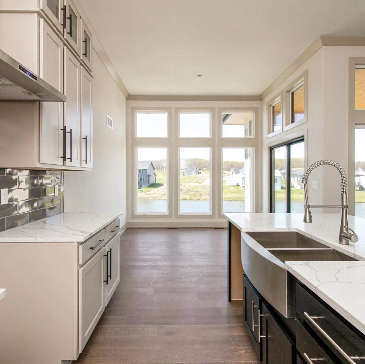 Small kitchen with walls of windows.