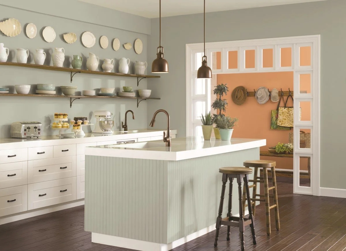 Kitchen with greenish gray colored island.