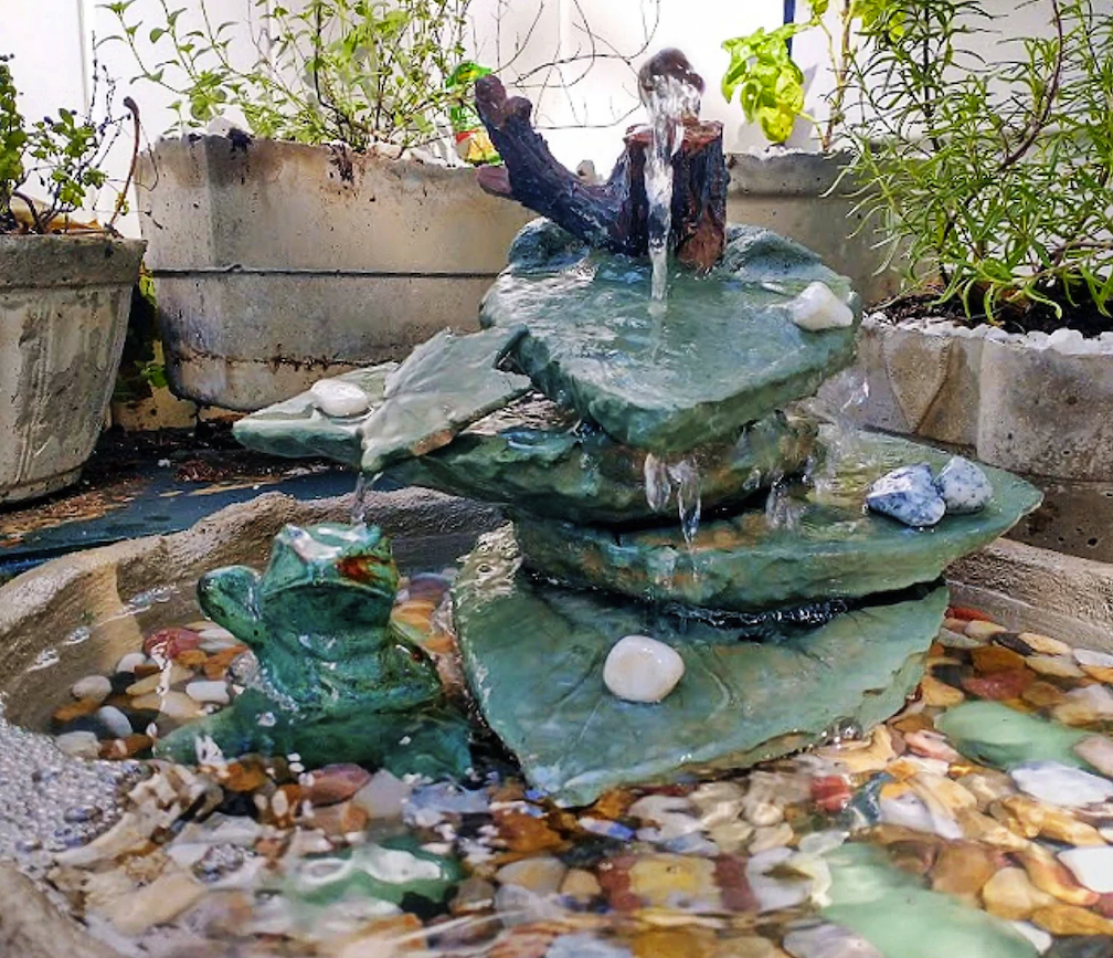 bird bath fountain with stacked rocks