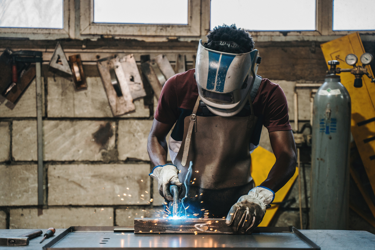 new year new skill how to weld your own stuff - man welding in home shop