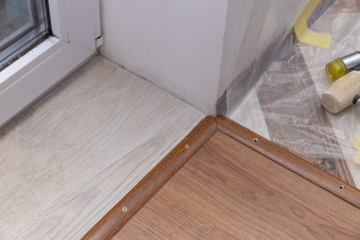 Three-different-types-of-flooring-meet-in-a-corner.