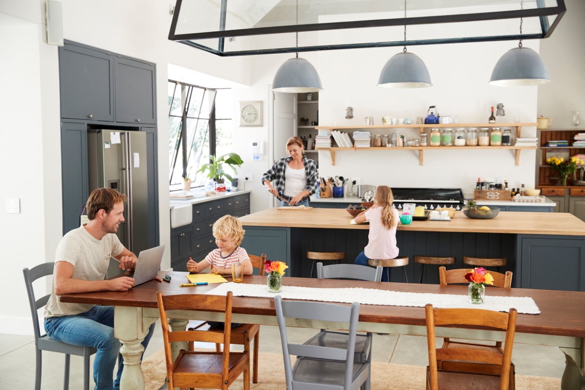 Family enjoying large open plan kitchen.