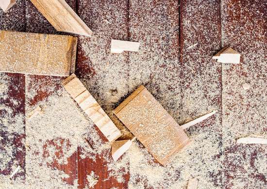 Gaps in wood being filled by saw dust