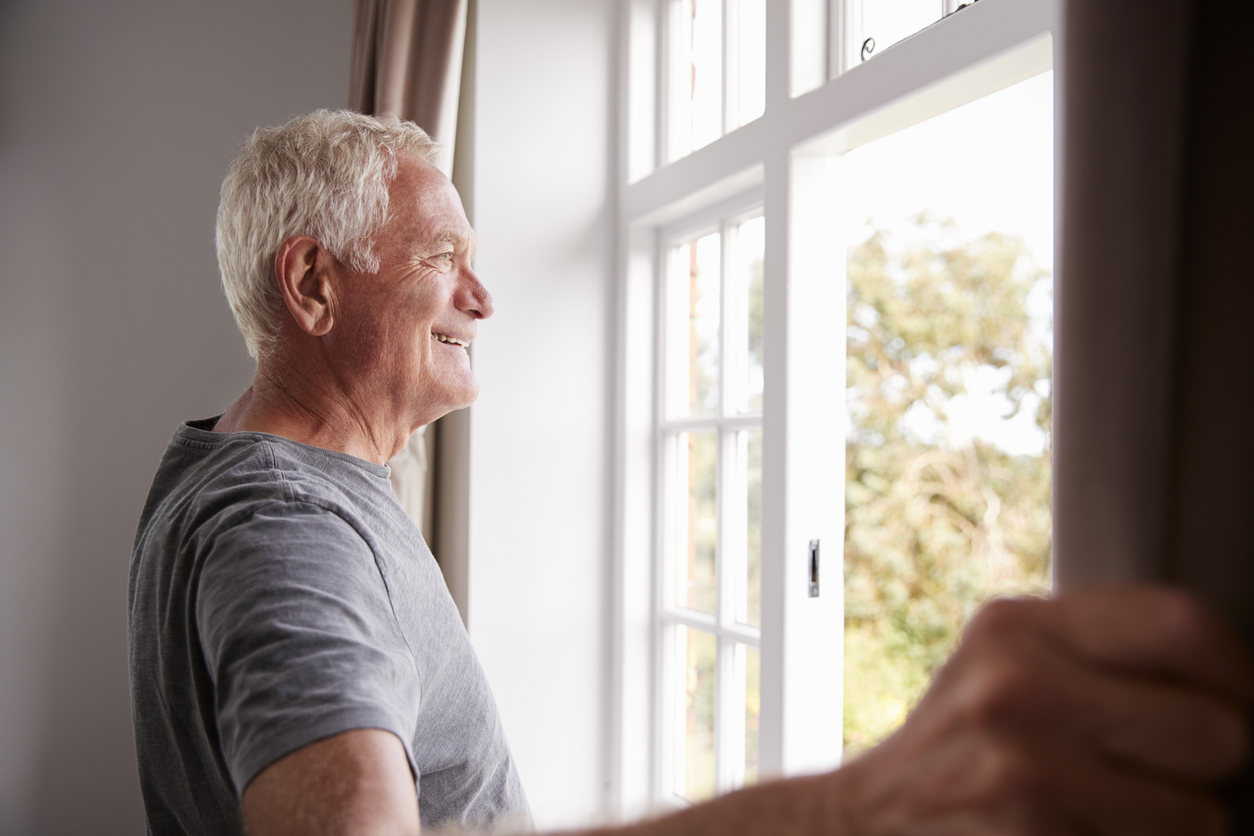 iStock-864345772 Forbidden New Years Chores Older Man Opening Window.jpg