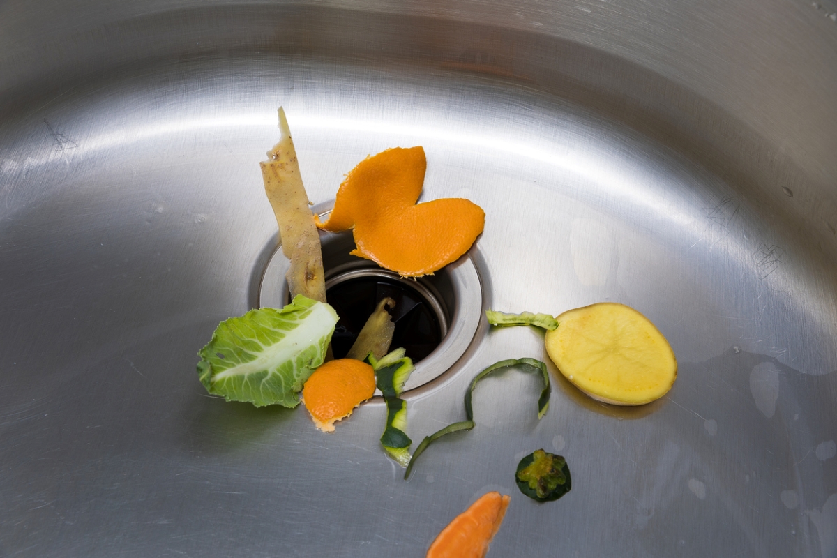 Food scraps around kitchen sink