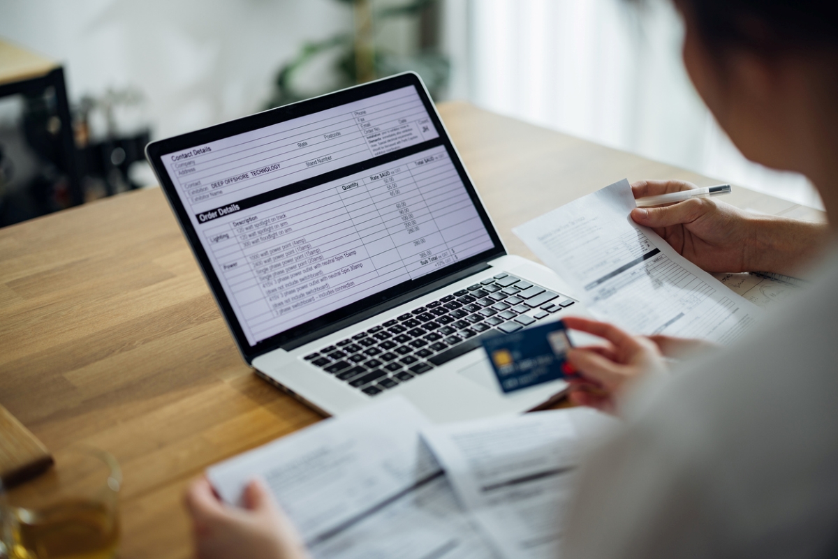 Person looking at credit card budget on laptop