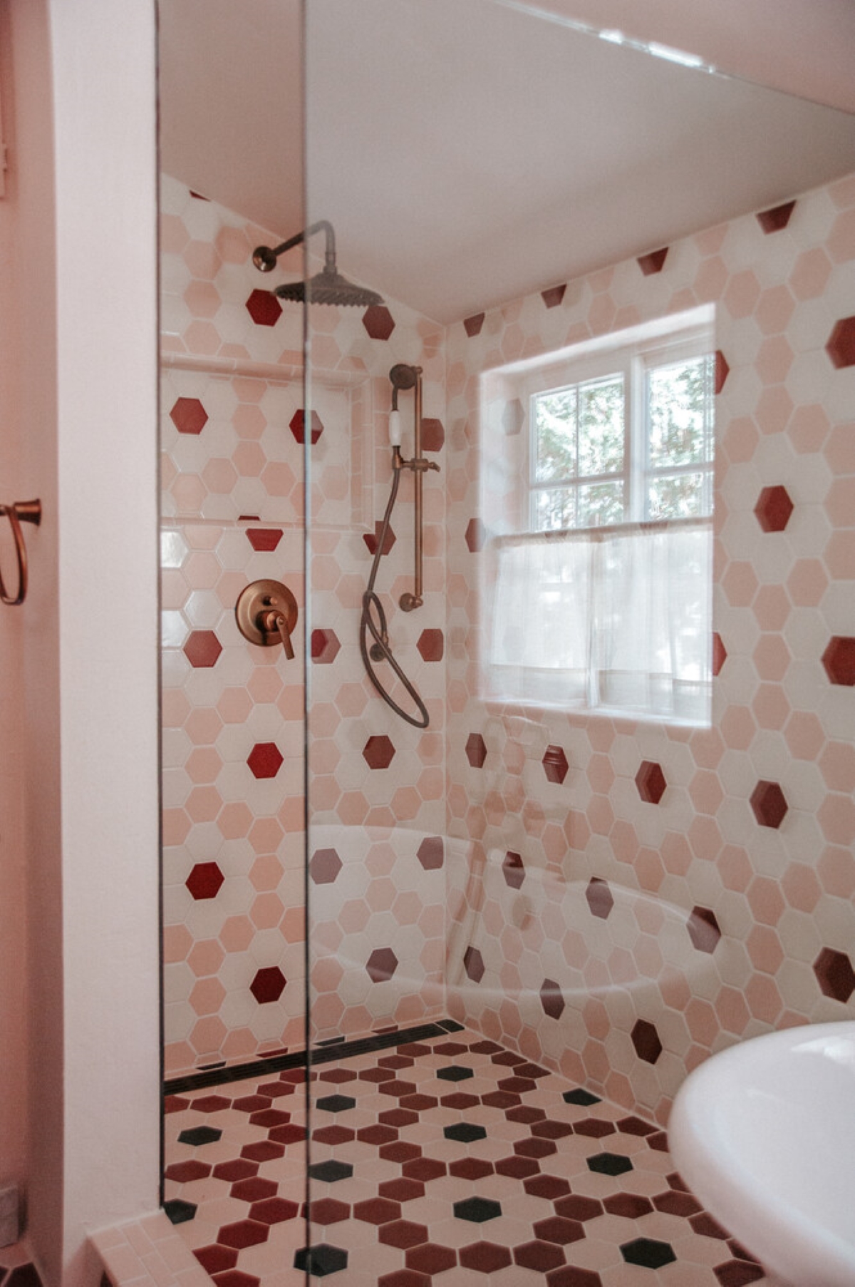 Pink hexagon tiles in bathroom