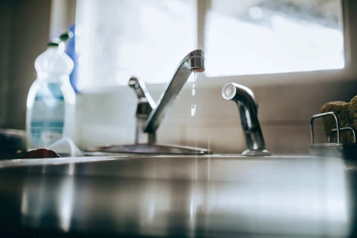 Water leaking from kitchen sink faucet