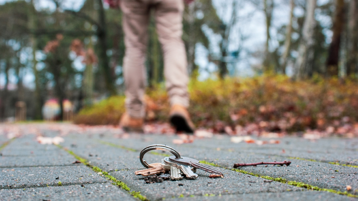 Keys on ground while person walks away