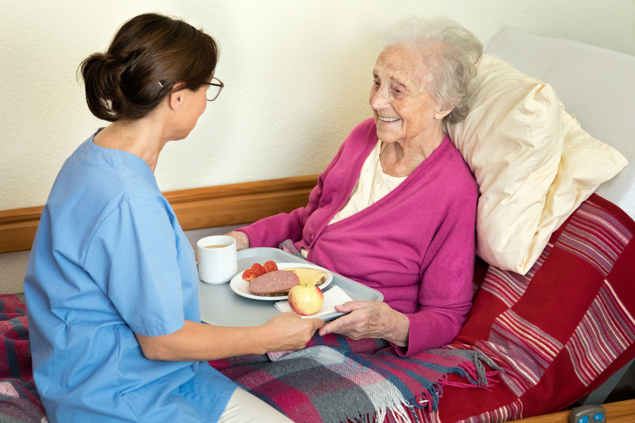 iStock-613342030 home healthcare senior woman in bed at home