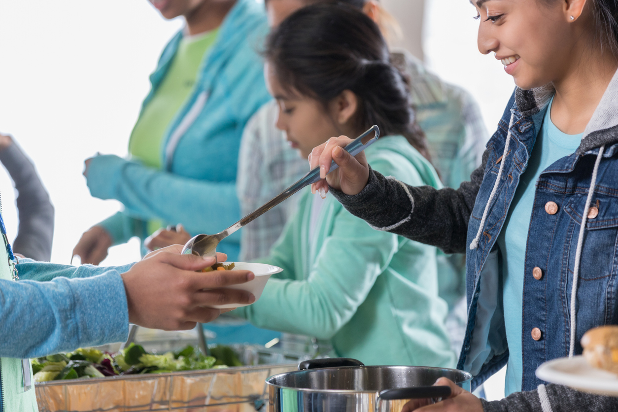 iStock-1016654946 volunteer opportunities serving food at a food kitchen