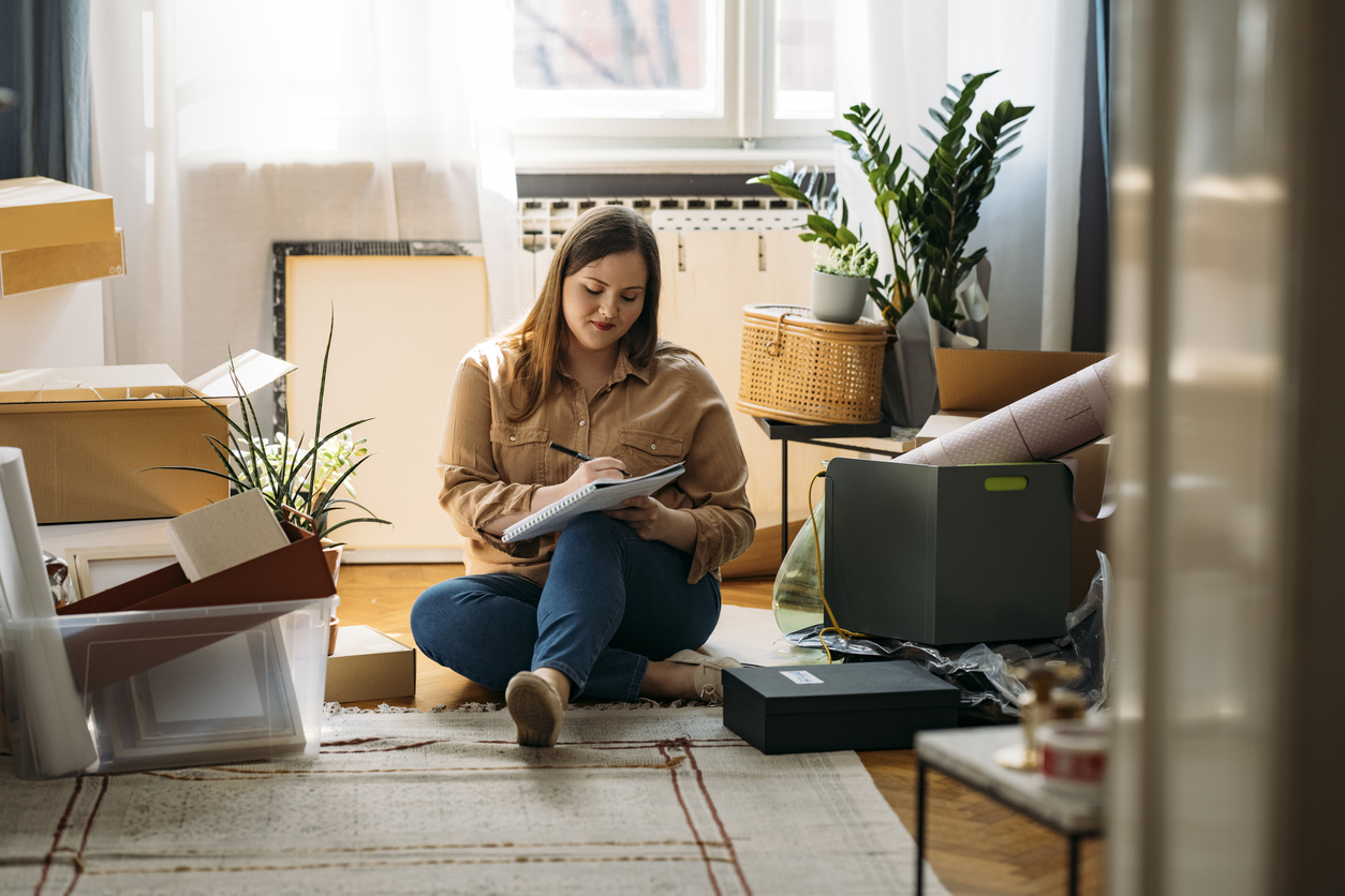 iStock-1346727107 productivity hacks woman writing to do list.