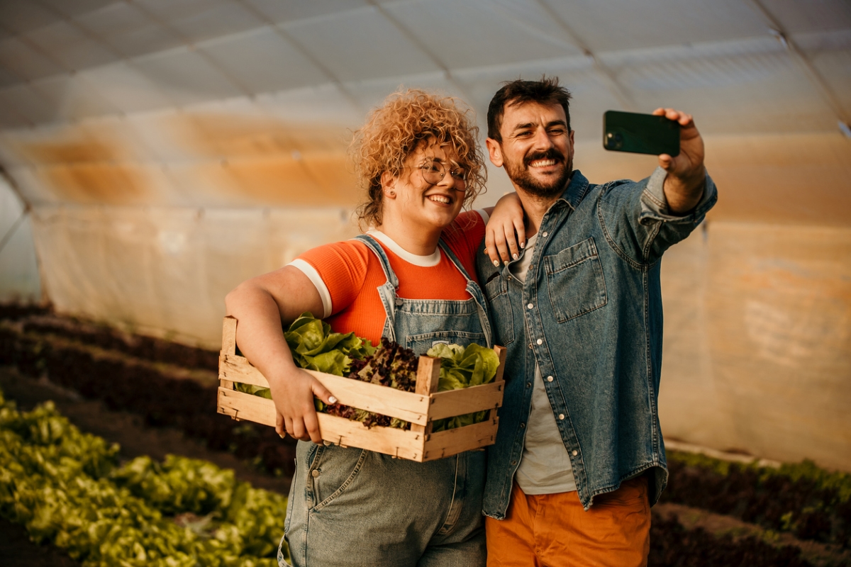 Couple of people taking selfie in garden