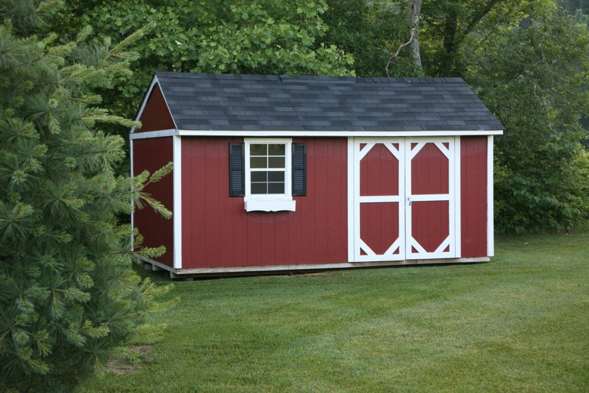 A red shed against a verdant backdrop.