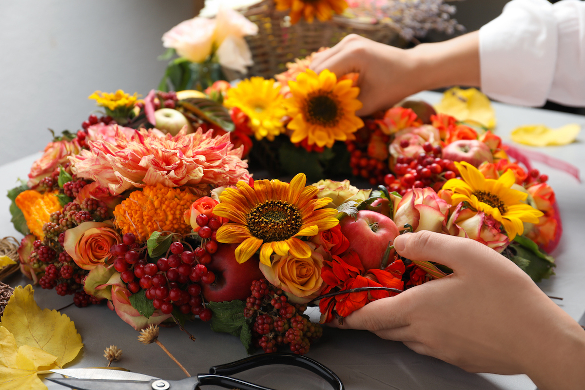 new year new skill diy florist making wreath with flowers and fruit