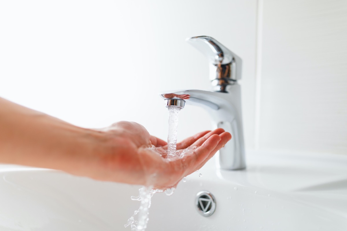 Bathroom sink tap running.