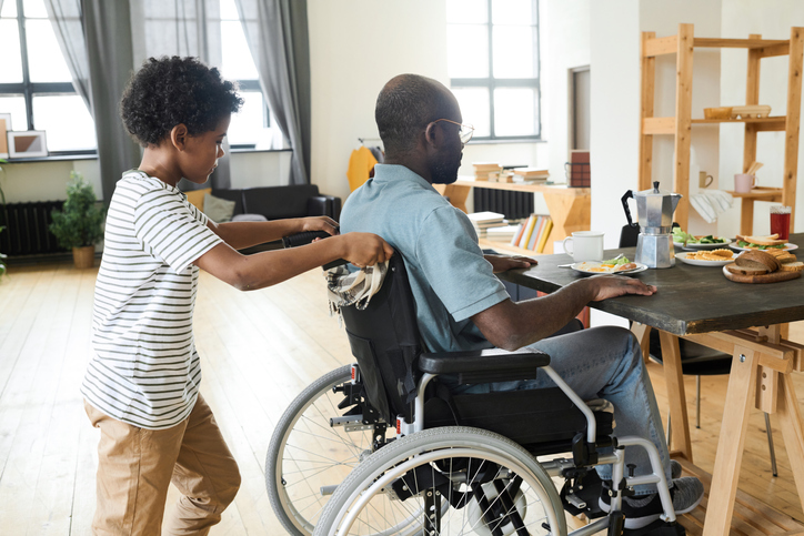 home-health-room-man-in-wheelchair-with-child